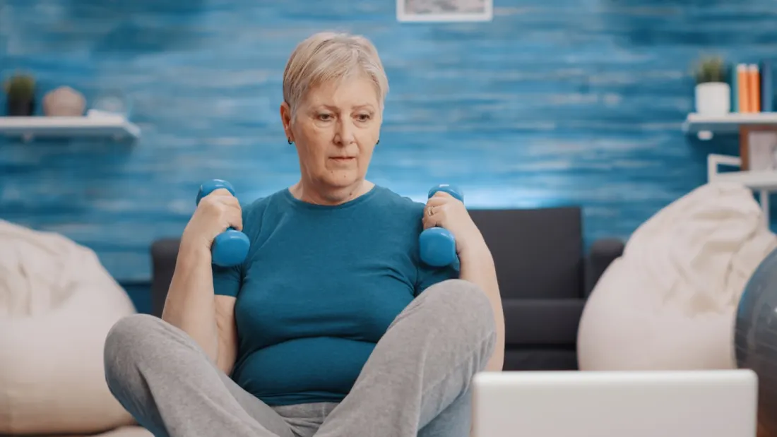 Beginner strength training with light dumbbells.