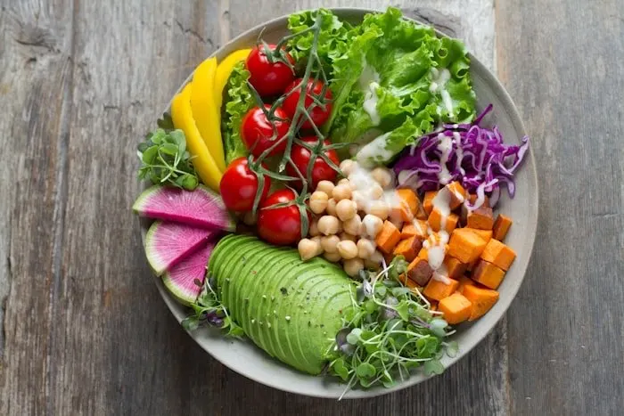 Colorful salad bowls on a table.
